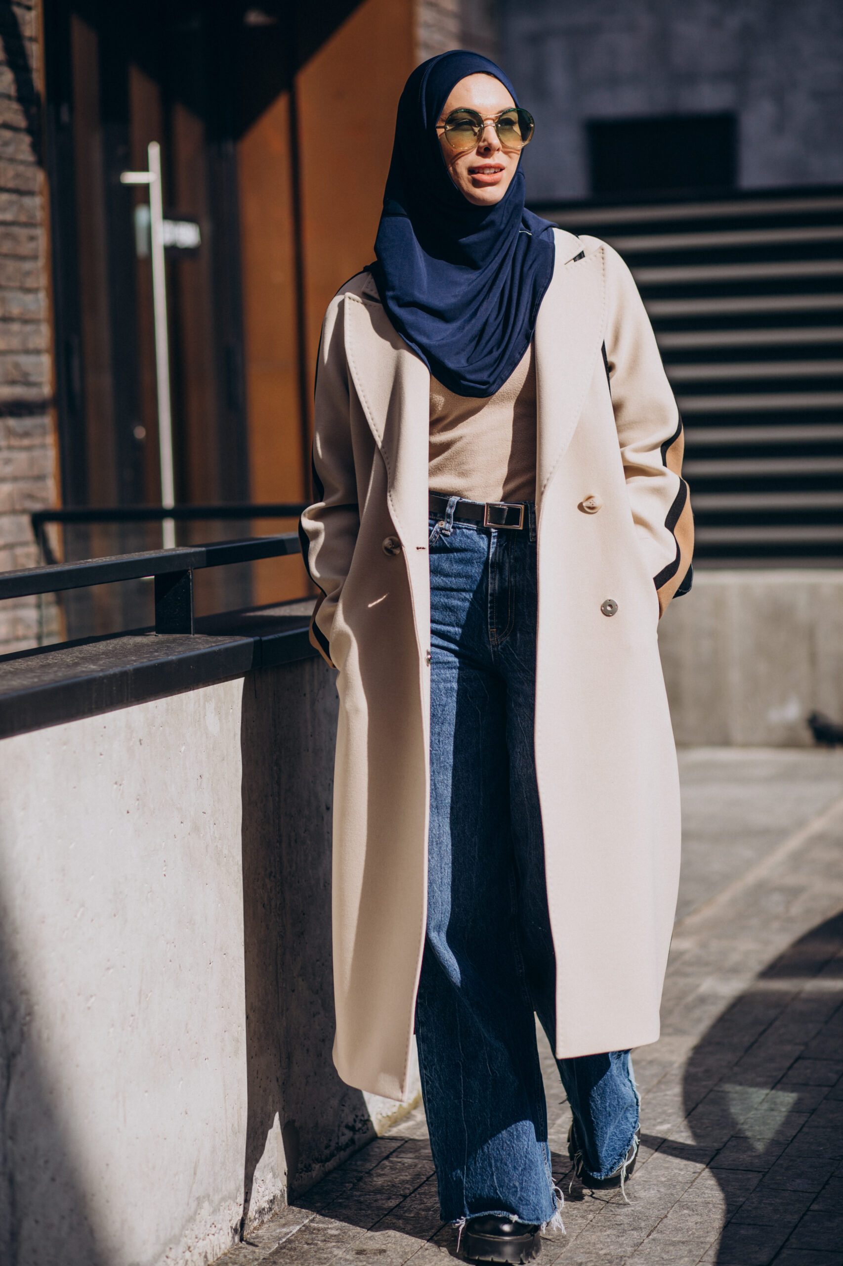 Modern muslim woman wearing headscarf walking in the street